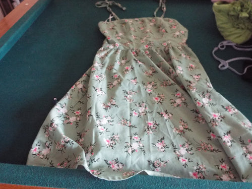 Green sundress size S. Previously worn and in good condition.